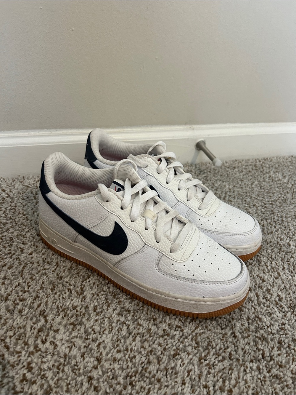 Nike Kids White Sneakers with Black Swoosh and Gum Sole